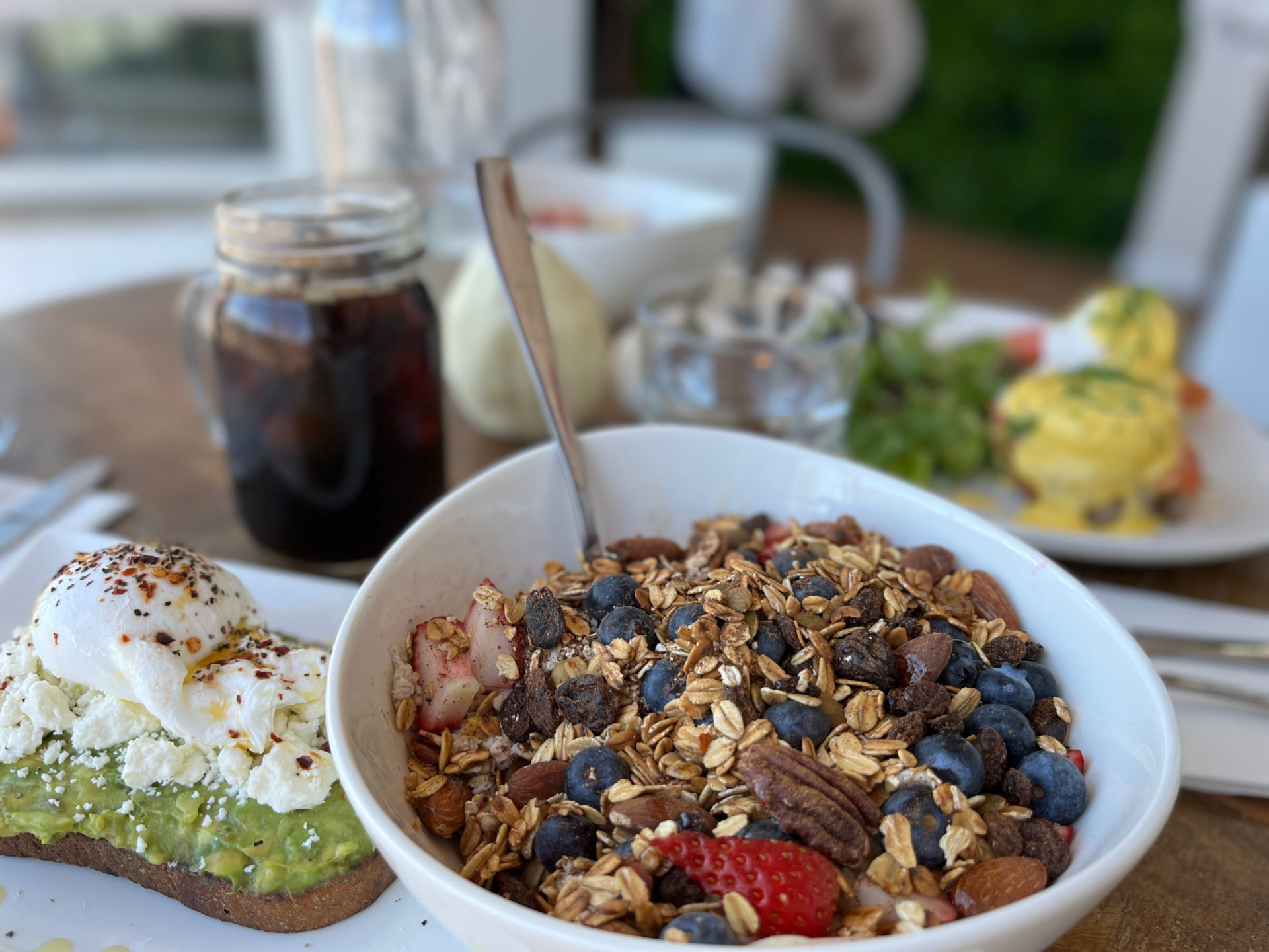 Café Diem breakfast: granola bowl with berries, avocado toast and cold brew